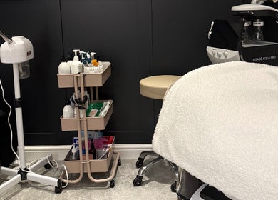 Cozy treatment room at SKinGlow.Co, Ripon, England, GB, featuring skincare tools and products.