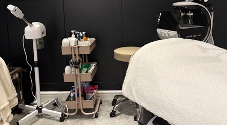 Cozy treatment room at SKinGlow.Co, Ripon, England, GB, featuring skincare tools and products.