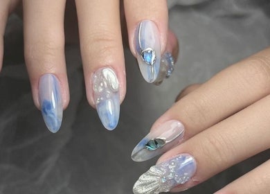 Elegant blue and silver nail art at Woo Salon Studio in Arcadia, California, US. Perfect for special occasions.