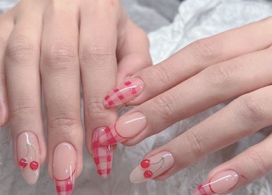 Stylish cherry and check nail art by Woo Salon Studio in Arcadia, California, US.