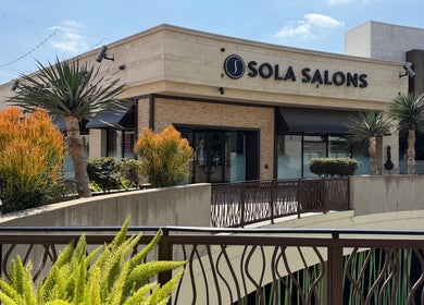 Exterior of Woo Salon Studio on a sunny day in Arcadia, California, US, framed by vibrant landscaping.