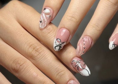 Intricate nail art featuring pink and silver designs at Woo Salon Studio in Arcadia, California, US.
