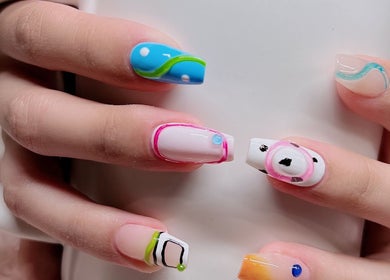 Colorful nail art design at Woo Salon Studio, Arcadia, California, US, showcasing vibrant patterns and creativity.