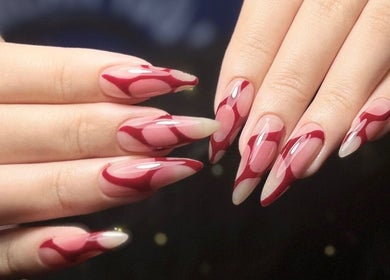 Elegant red and nude nail art at Woo Salon Studio, Arcadia, California, US.