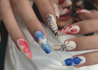 Intricate nail art design at Woo Salon Studio, Arcadia, California, US, featuring vibrant colors and patterns.