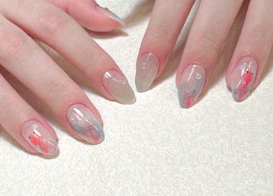 Elegant nail art at Woo Salon Studio in Arcadia, California, US, showcasing intricate designs and glossy finish.