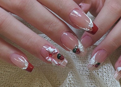 Elegant holiday-themed nail art at Woo Salon Studio, Arcadia, California, US, showcasing intricate designs.