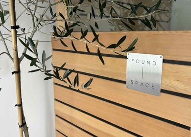 Elegant wooden décor at The Recovery Room, Taupō, Waikato Region, NZ, featuring sleek design lines with greenery.
