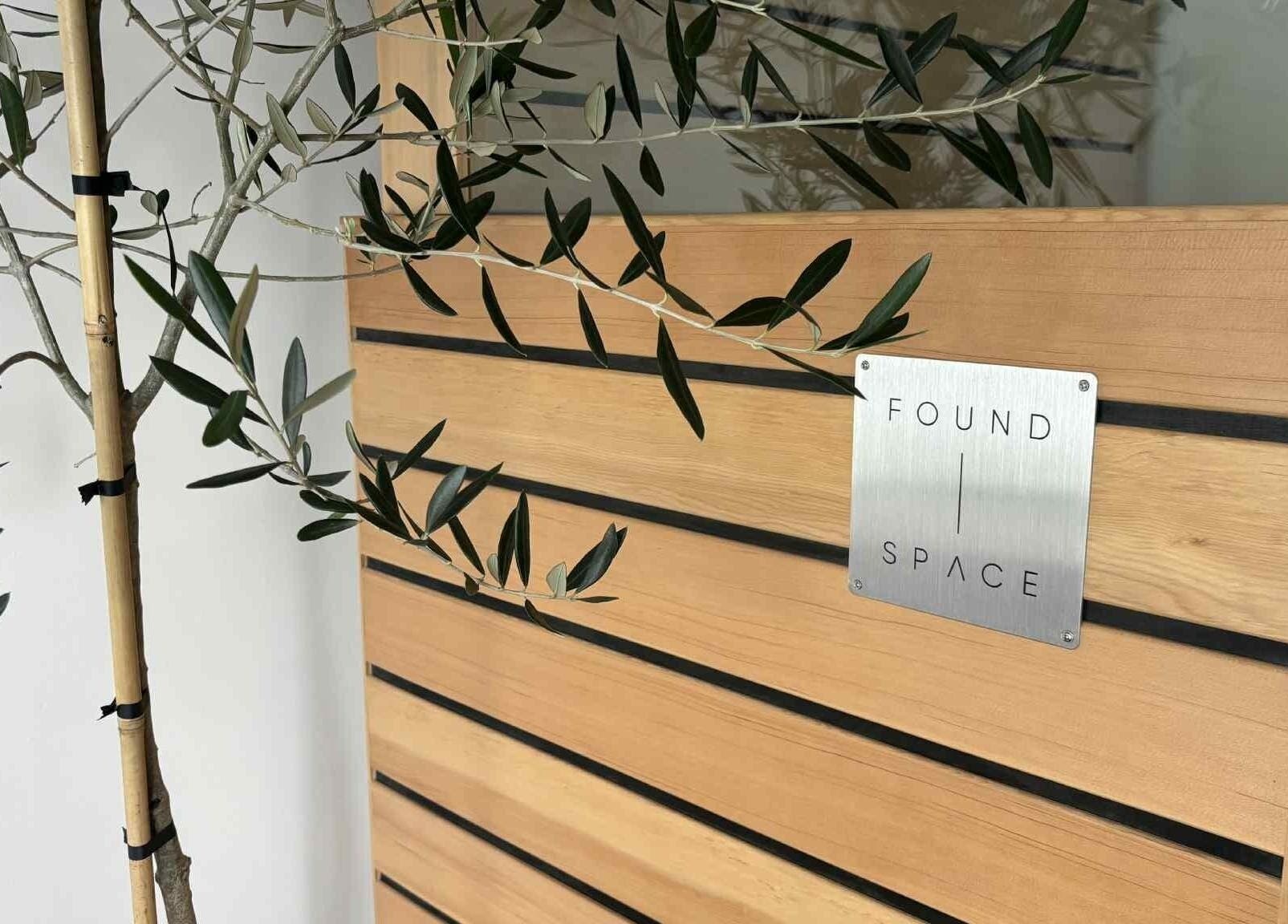 Elegant wooden décor at The Recovery Room, Taupō, Waikato Region, NZ, featuring sleek design lines with greenery.