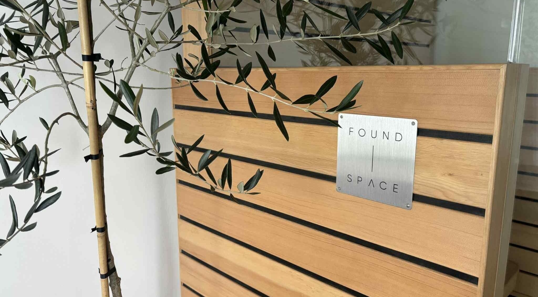 Elegant wooden décor at The Recovery Room, Taupō, Waikato Region, NZ, featuring sleek design lines with greenery.