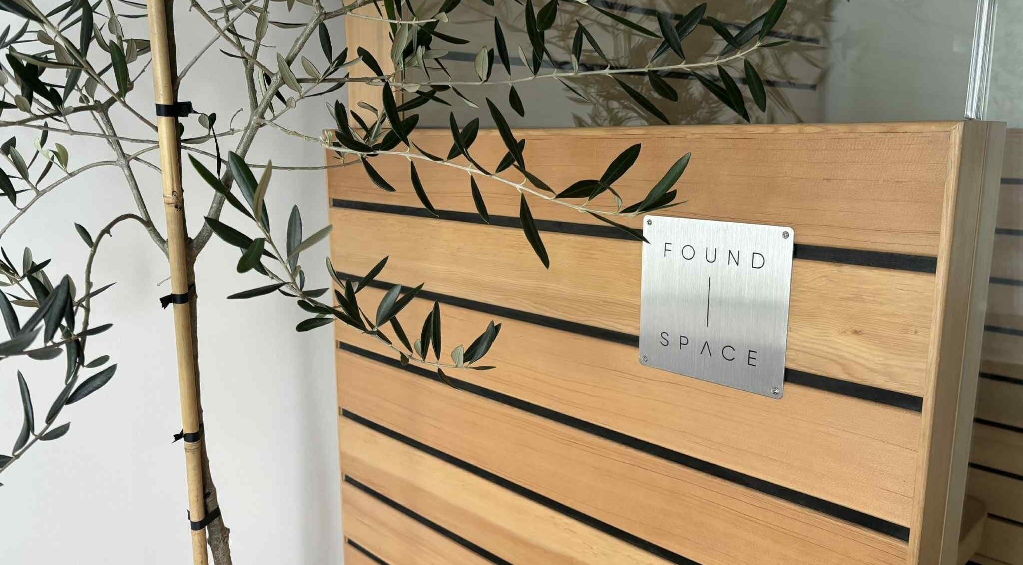 Elegant wooden décor at The Recovery Room, Taupō, Waikato Region, NZ, featuring sleek design lines with greenery.