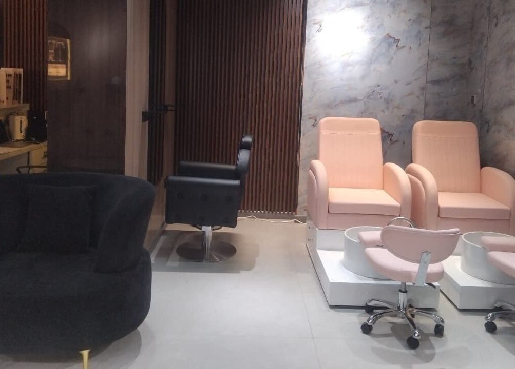 Elegant seating at Hair Talkz Mercure Gold Hotel in Dubai, Dubai, AE, featuring plush chairs and a modern design.