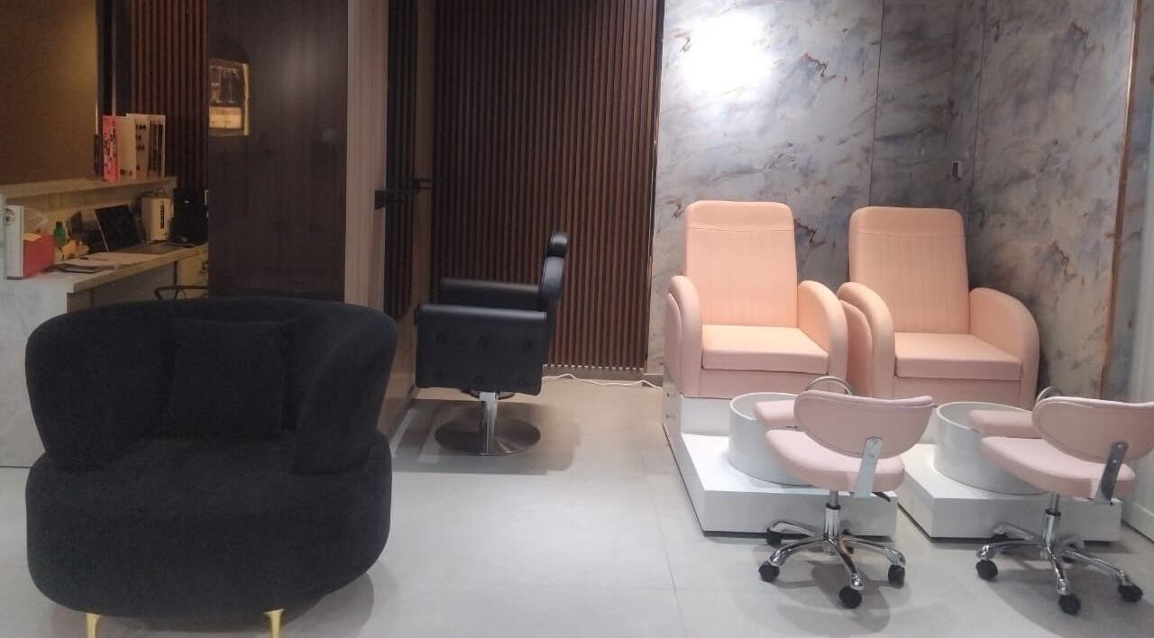 Elegant seating at Hair Talkz Mercure Gold Hotel in Dubai, Dubai, AE, featuring plush chairs and a modern design.