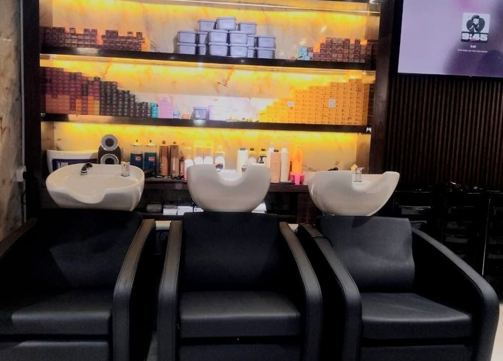 Elegant wash stations at Hair Talkz Mercure Gold Hotel, Dubai, Dubai, AE, offering premium hair care experience.