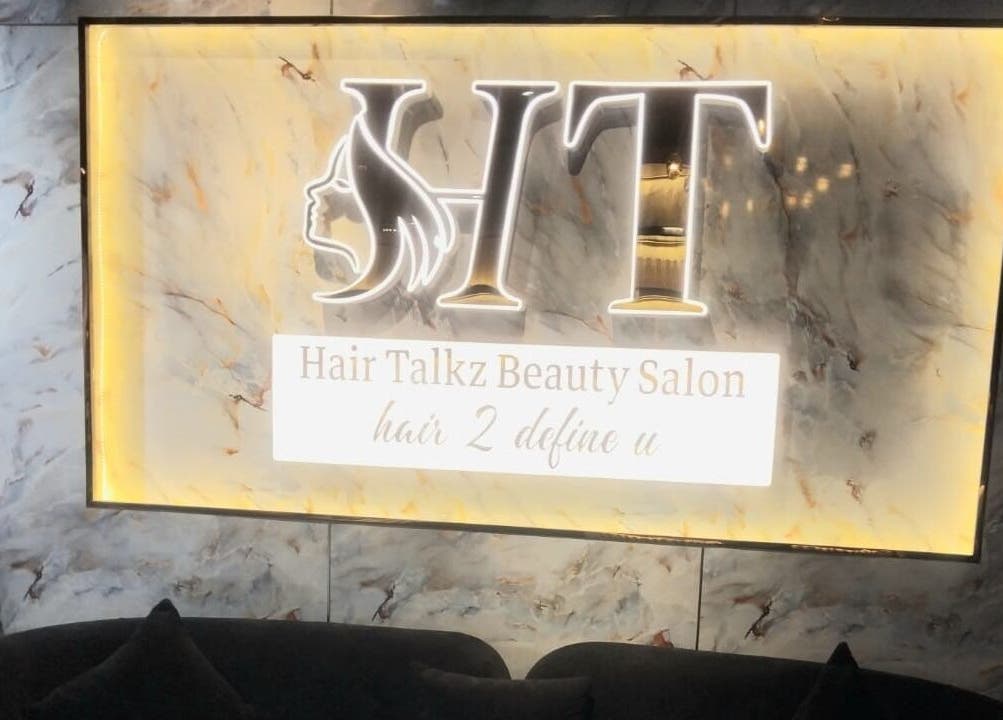 Luxurious interior sign of Hair Talkz Mercure Gold Hotel, Dubai, Dubai, AE with marble finish.