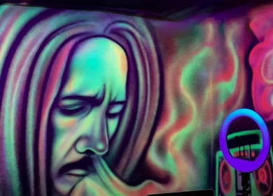 Colorful wall art at Dream Fade Gents Salon in Dubai, Dubai, AE, featuring vibrant abstract designs.