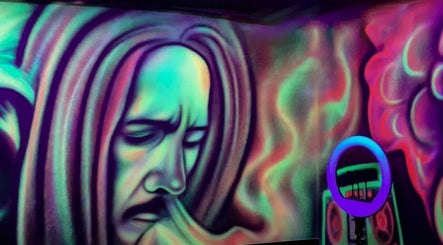Colorful wall art at Dream Fade Gents Salon in Dubai, Dubai, AE, featuring vibrant abstract designs.