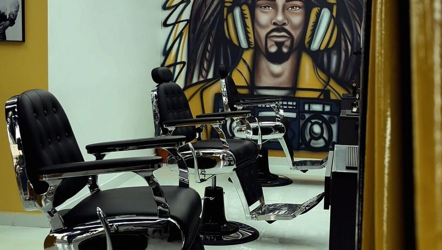 Stylish barber chairs in Dream Fade Barbershop, Dubai, Dubai, AE with unique wall art backdrop.