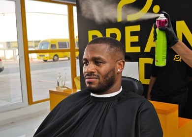 Client receiving hair treatment at Dream Fade barbershop, Dubai, Dubai, AE.