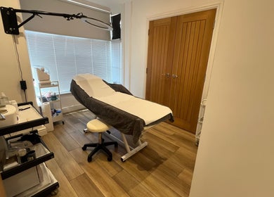 Treatment room at Blooms Beauty Room, Burgess Hill, England, GB, featuring a cozy massage table and serene decor.