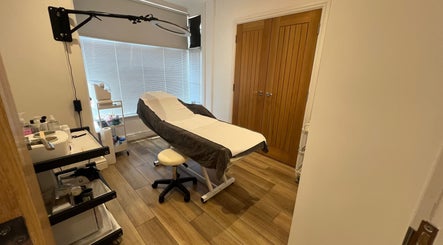 Treatment room at Blooms Beauty Room, Burgess Hill, England, GB, featuring a cozy massage table and serene decor.