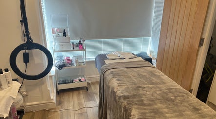Treatment room at Blooms Beauty Room, Burgess Hill, England, GB, featuring a comfortable massage table and soothing decor.