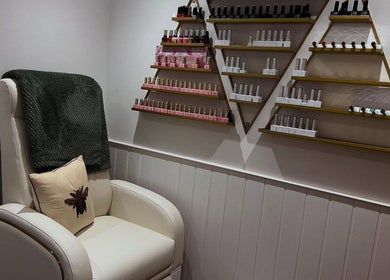 Comfortable pedicure chair and nail polish display at Blooms Beauty Room, Burgess Hill, England, GB.