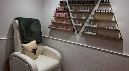 Comfortable pedicure chair and nail polish display at Blooms Beauty Room, Burgess Hill, England, GB.