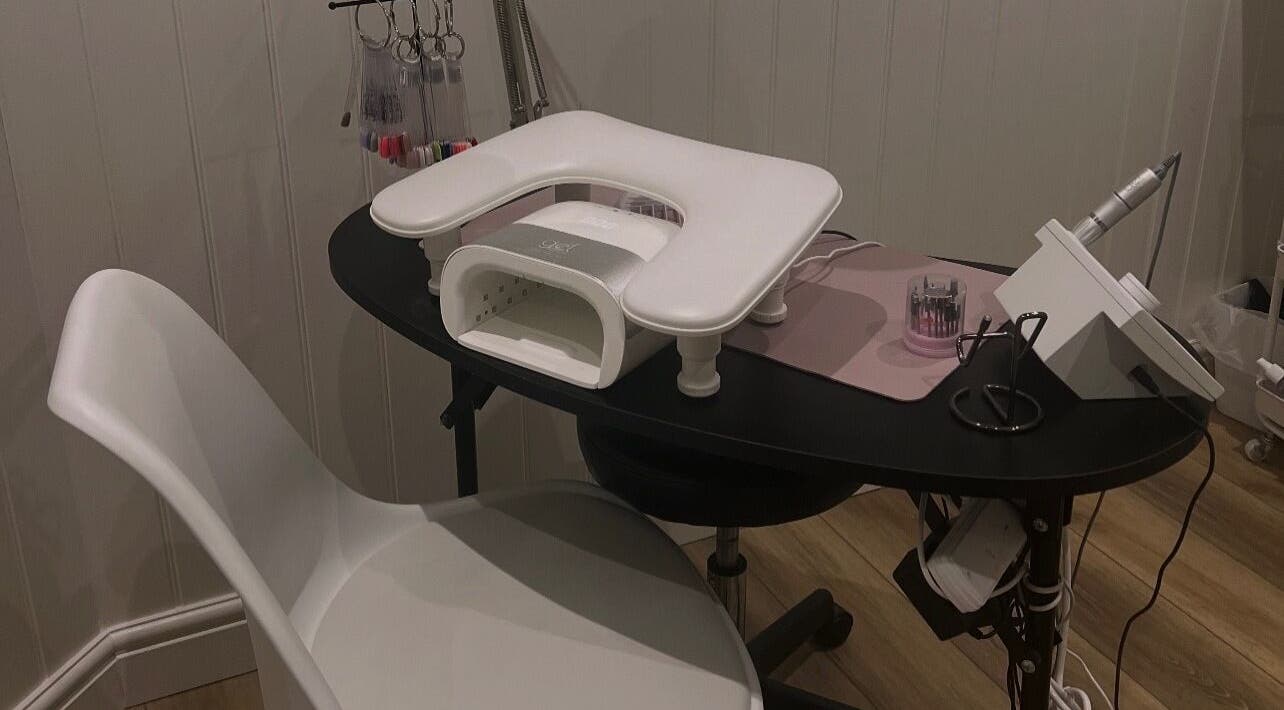 Nail station at Blooms Beauty Room in Burgess Hill, England, GB, featuring modern equipment and a sleek design.