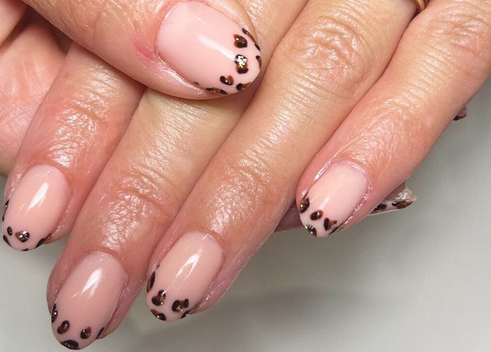 Elegant leopard nail art by Blooms Beauty Room in Burgess Hill, England, GB. Perfect for fashionable styles.