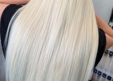 Stunning blonde hair extensions from Adore Hair Extensions in Bristol, England, GB showcase sleek and silky finish.