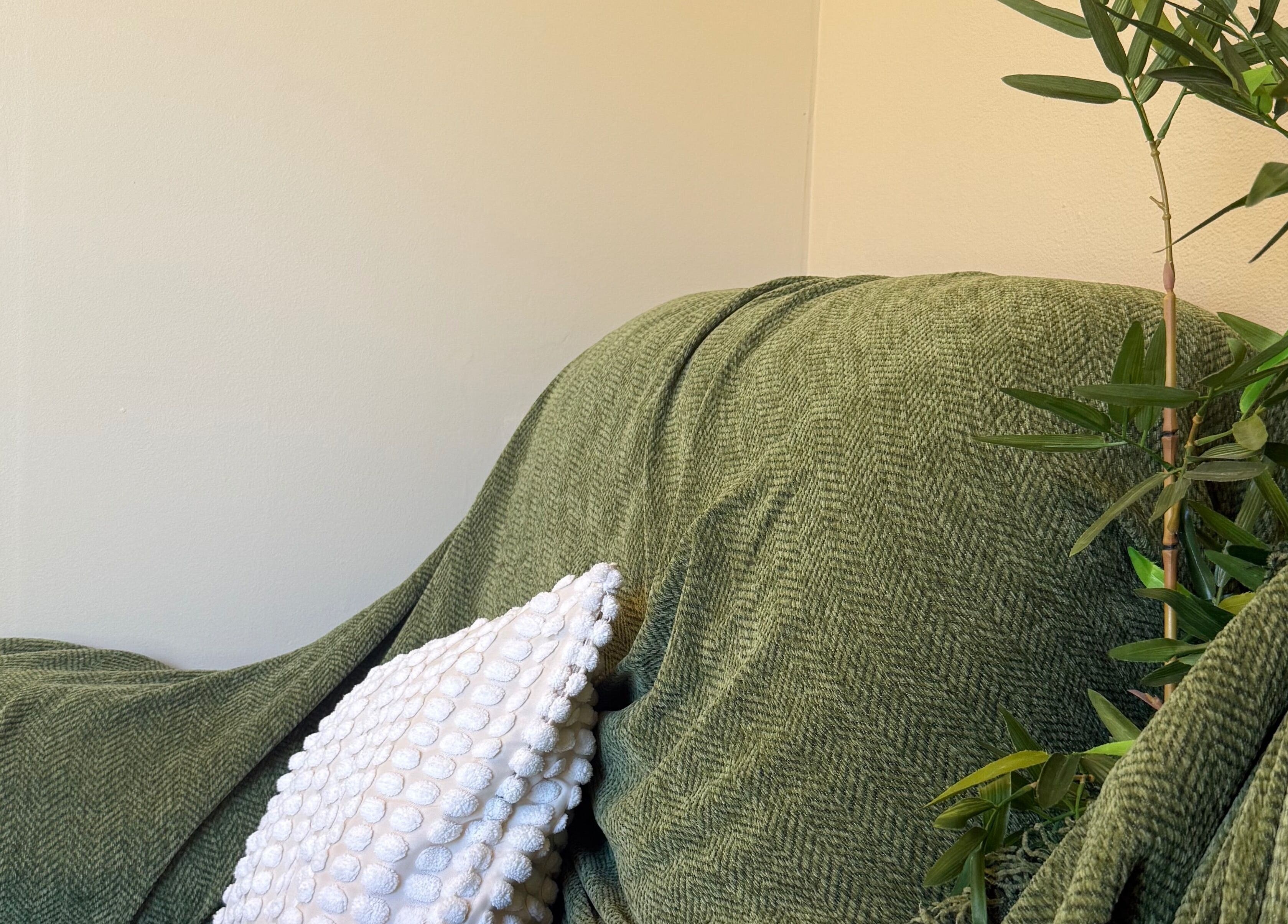 Cozy green chair with a white cushion at Carlton Remedial Thai Massage, Carlton, New South Wales, AU.