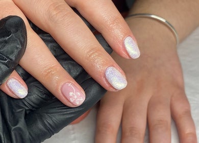 Shimmery manicure with floral design at Alex at Beauty Secrets, Douglas, IM.