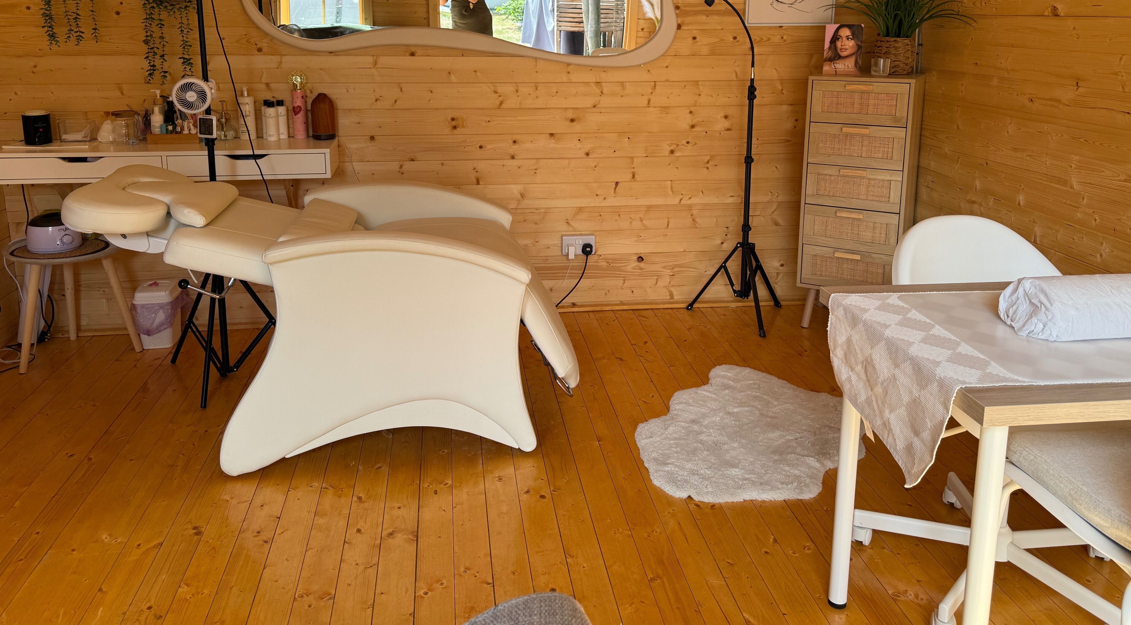 Cozy interior of Lumora Belle Beauty in Loughborough, England, showcasing a comfortable beauty treatment room.