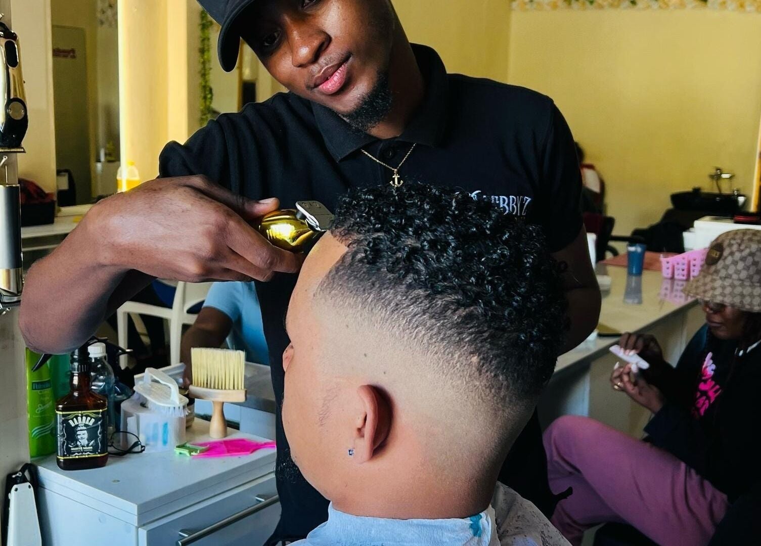 Skilled barber at Lebbyz Fade Cutz creating a detailed fade in Windhoek, Khomas Region, NA.
