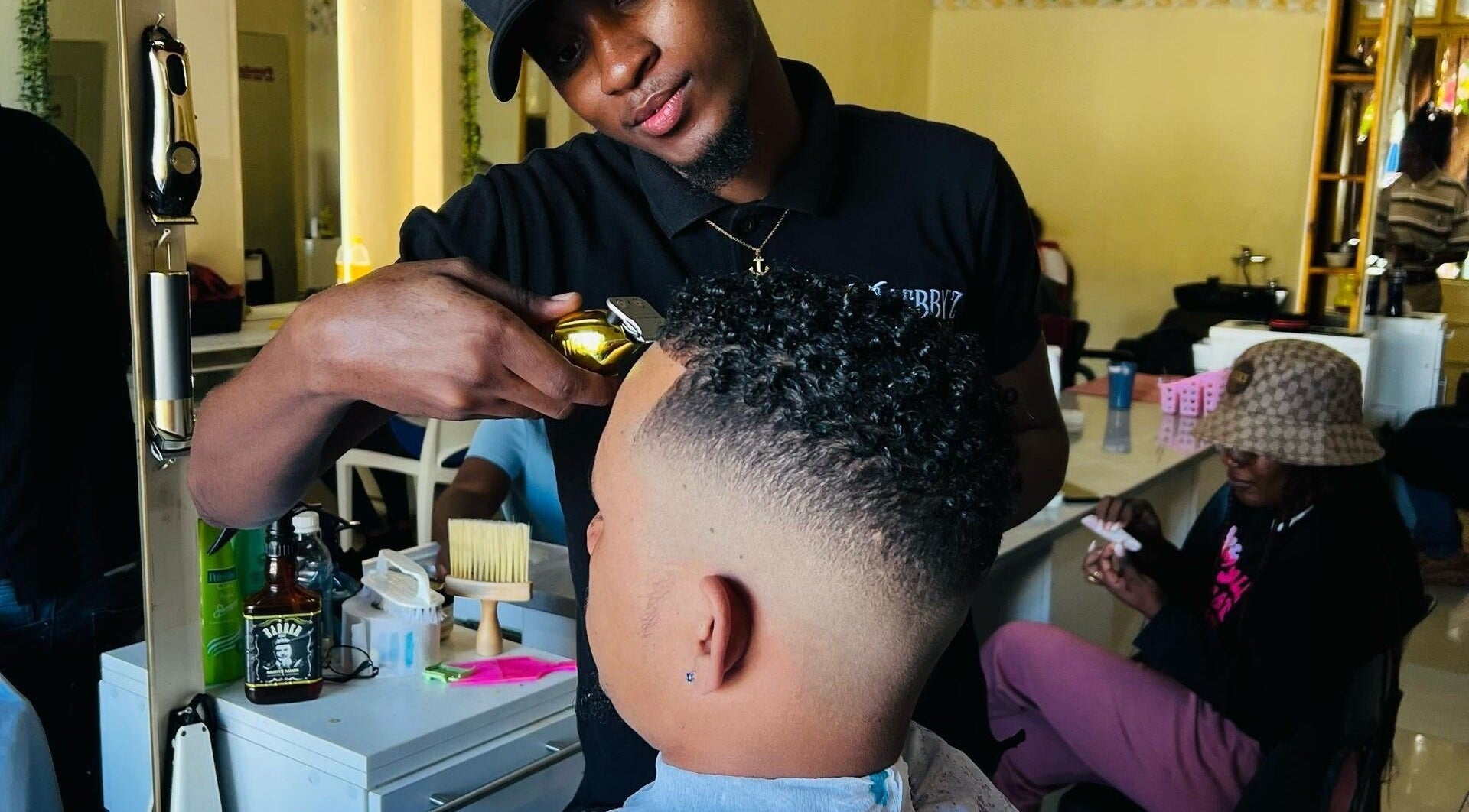 Skilled barber at Lebbyz Fade Cutz creating a detailed fade in Windhoek, Khomas Region, NA.