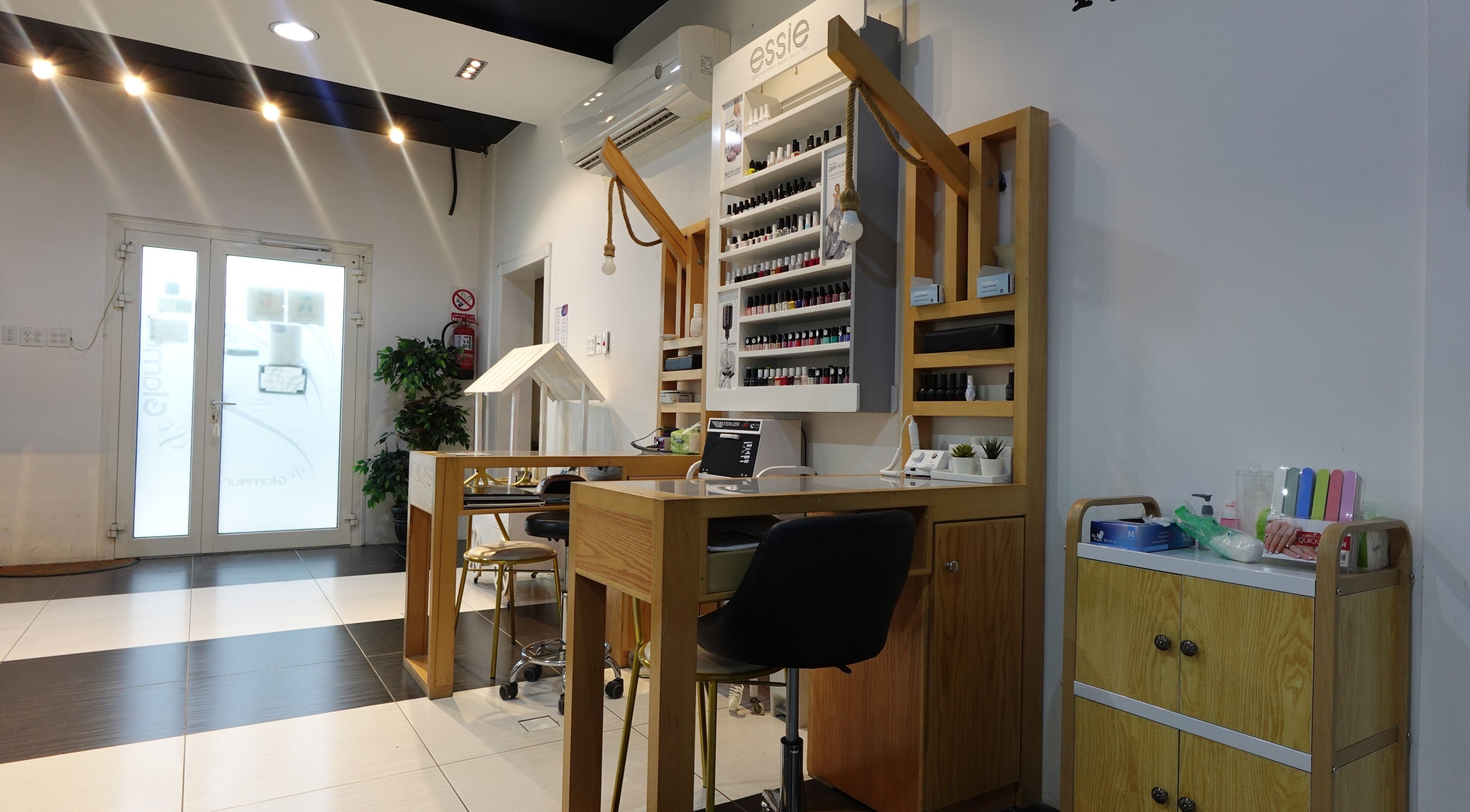 Modern nail salon area at Le Glamour Center, Saihat, Eastern Province, SA, featuring stylish decor.