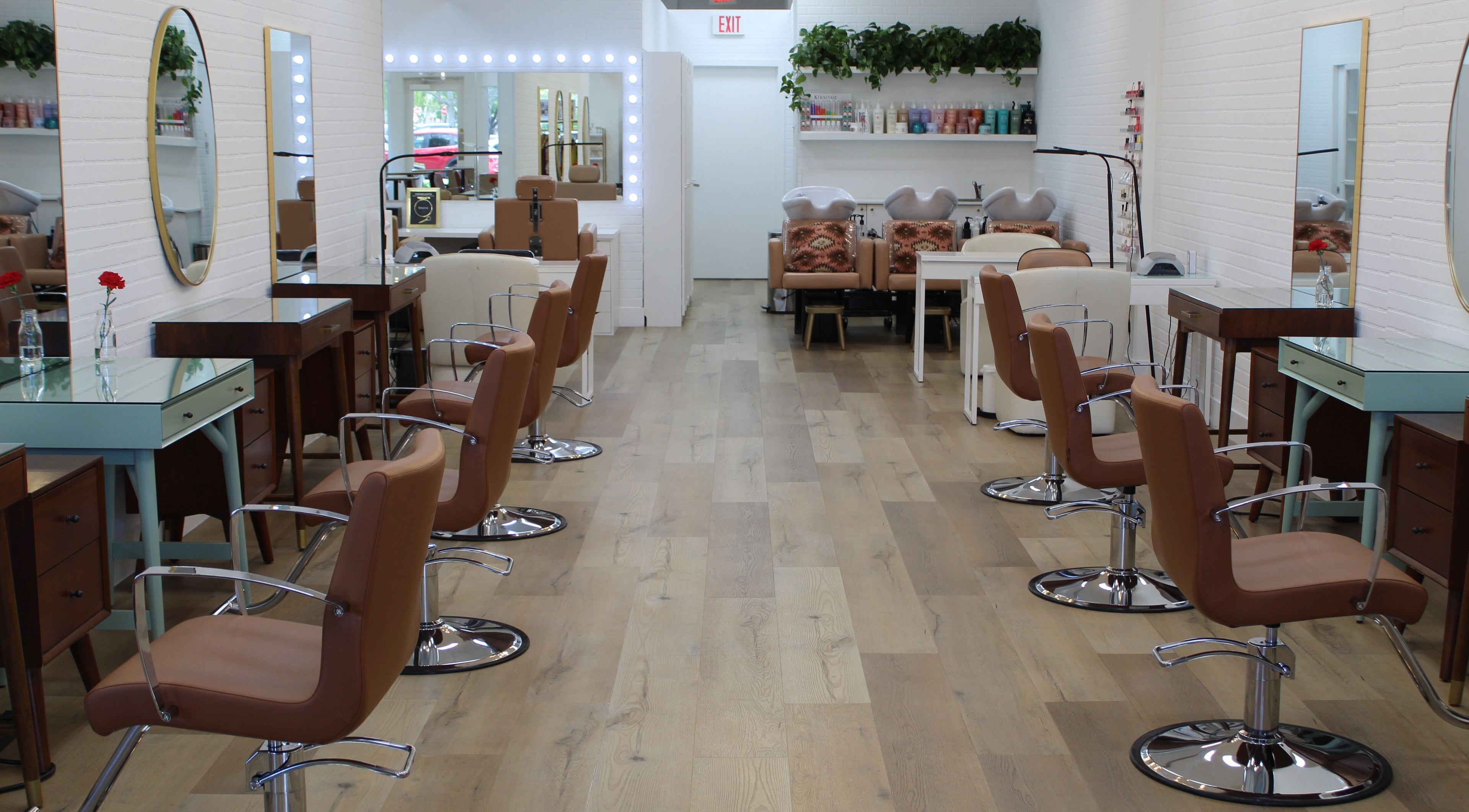 Elegant styling area at Blend Hair Boutique, Plantation, Florida, US with modern chairs and mirrors.
