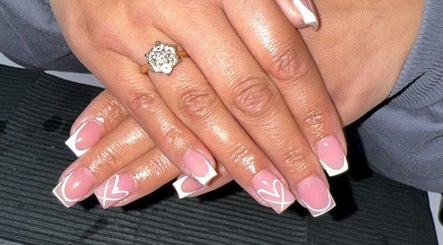 Close-up of elegant pink and white heart nails at Bee’s Beauty, Coventry, England, GB.