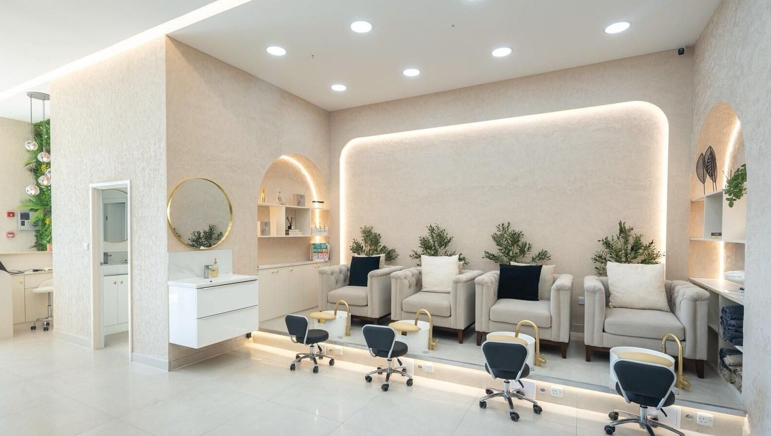 Elegant nail salon at Amore Beam Park in Rainham, England, GB featuring plush chairs and modern decor.