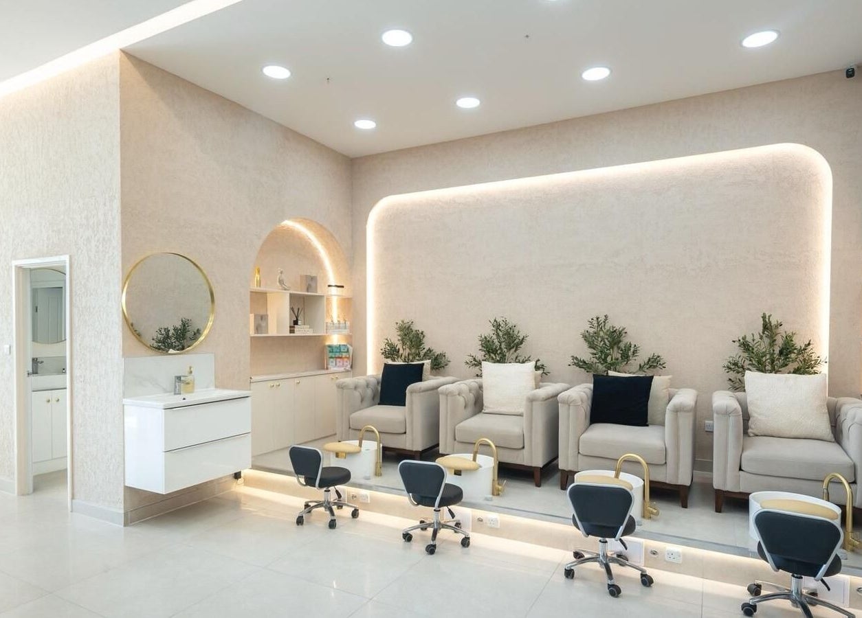 Elegant nail salon at Amore Beam Park in Rainham, England, GB featuring plush chairs and modern decor.