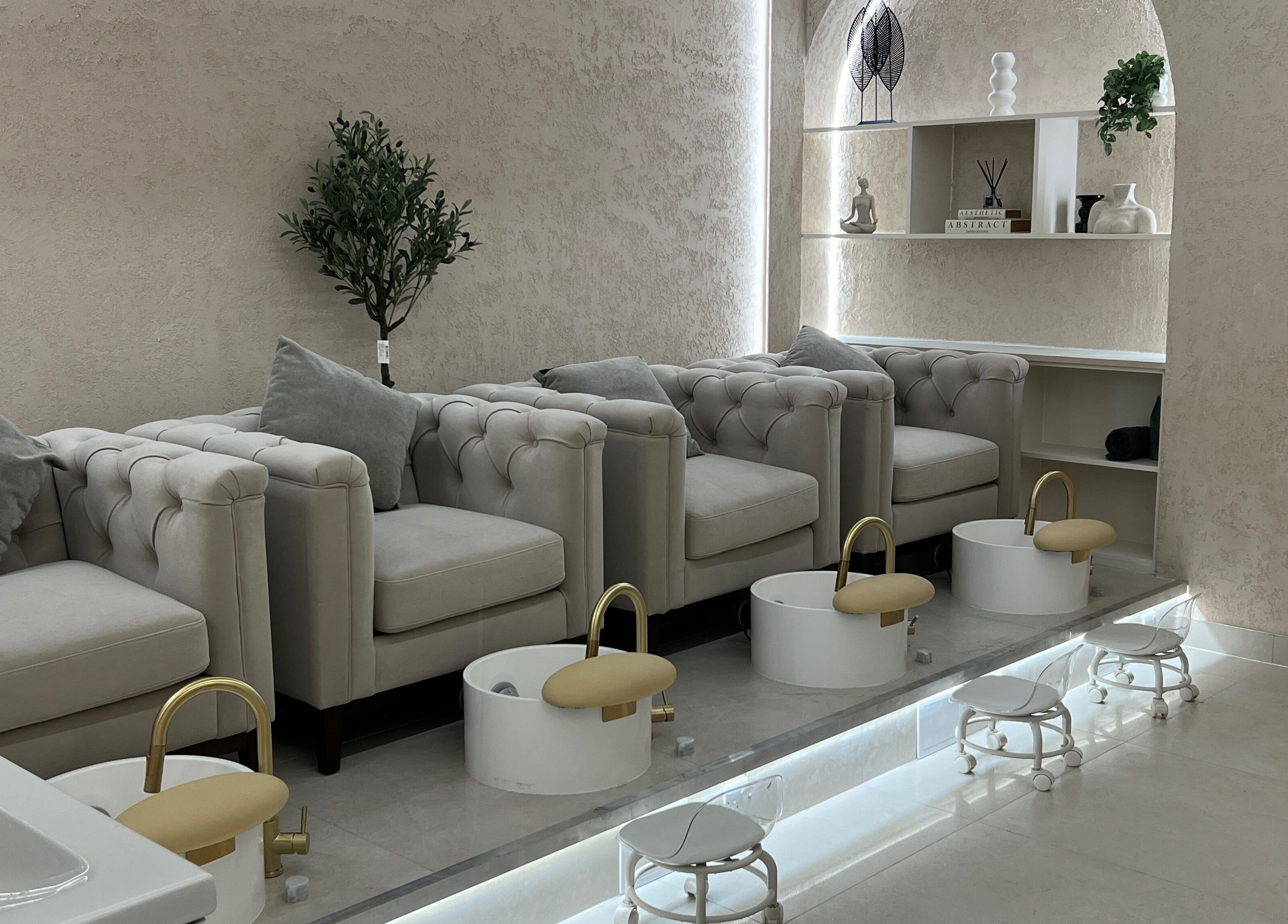 Luxurious pedicure lounge at Amore Beam Park, Rainham, England, GB with plush seating and modern decor.