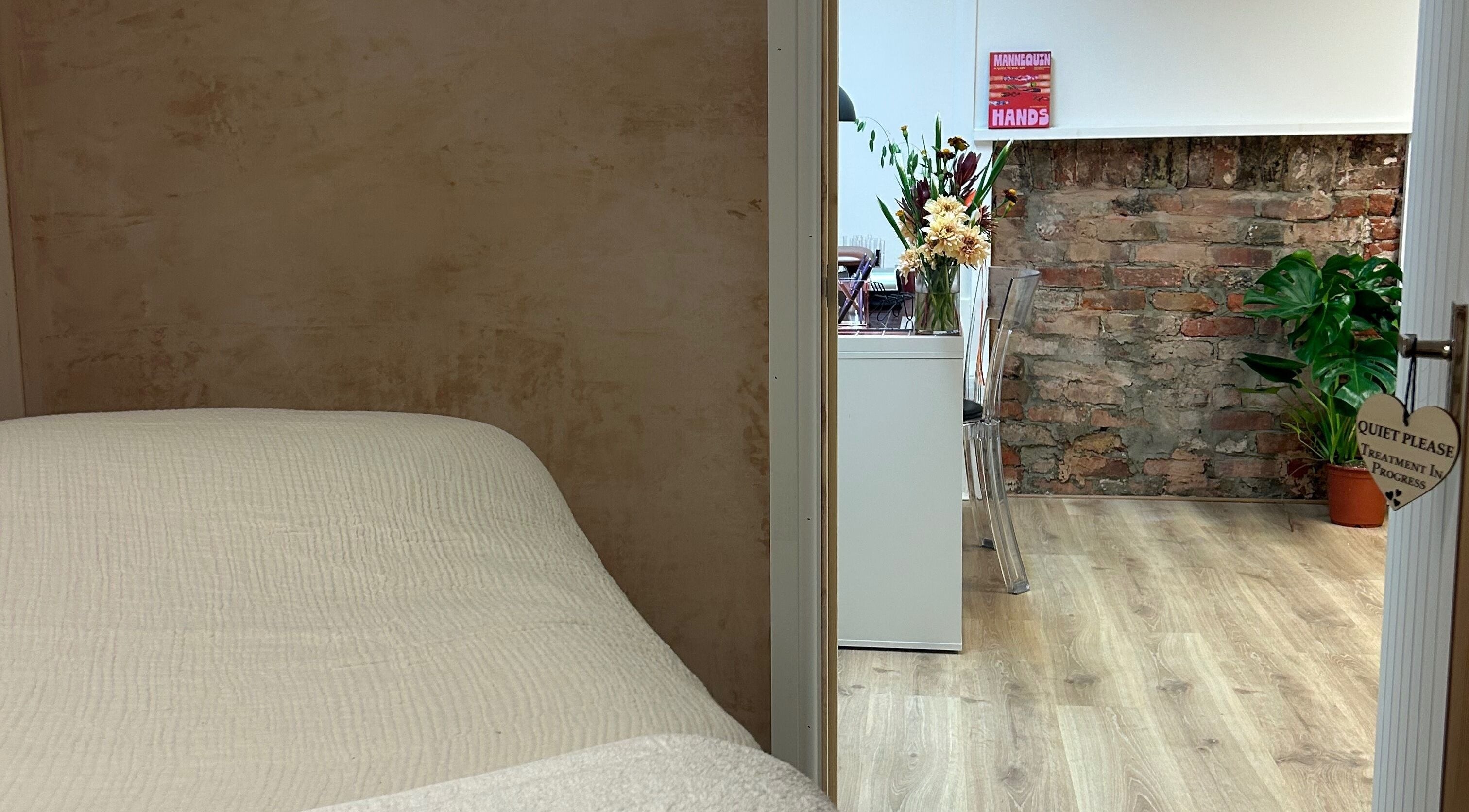 View of serene room and floral decor at Louise Knight Beauty, St Albans, England, GB.