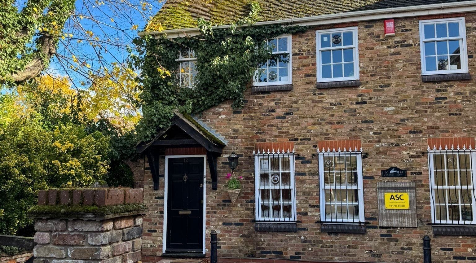 Front view of Louise Knight Beauty, a charming brick building in St Albans, England, GB.
