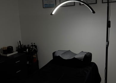 Beauty By Cy's tranquil treatment room in Austral, New South Wales, AU with elegant decor and modern lighting.