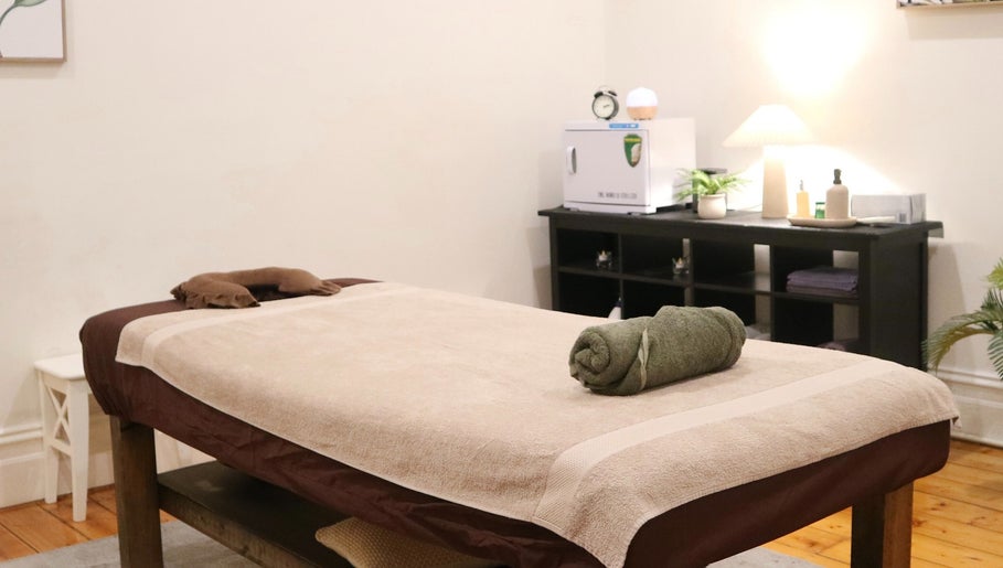 Cozy massage room at Yarraville Massage, Melbourne, Victoria, AU, with a neatly prepared massage table.