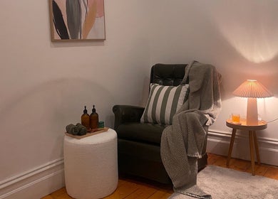 Cozy corner with armchair at Yarraville Massage, Melbourne, Victoria, AU, enhancing relaxation and comfort.