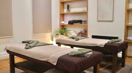 Calming Yarraville Massage room with two massage tables in Melbourne, Victoria, AU, promoting relaxation.