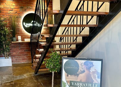Welcoming entrance of Yarraville Massage with plants and signage, located in Melbourne, Victoria, AU.