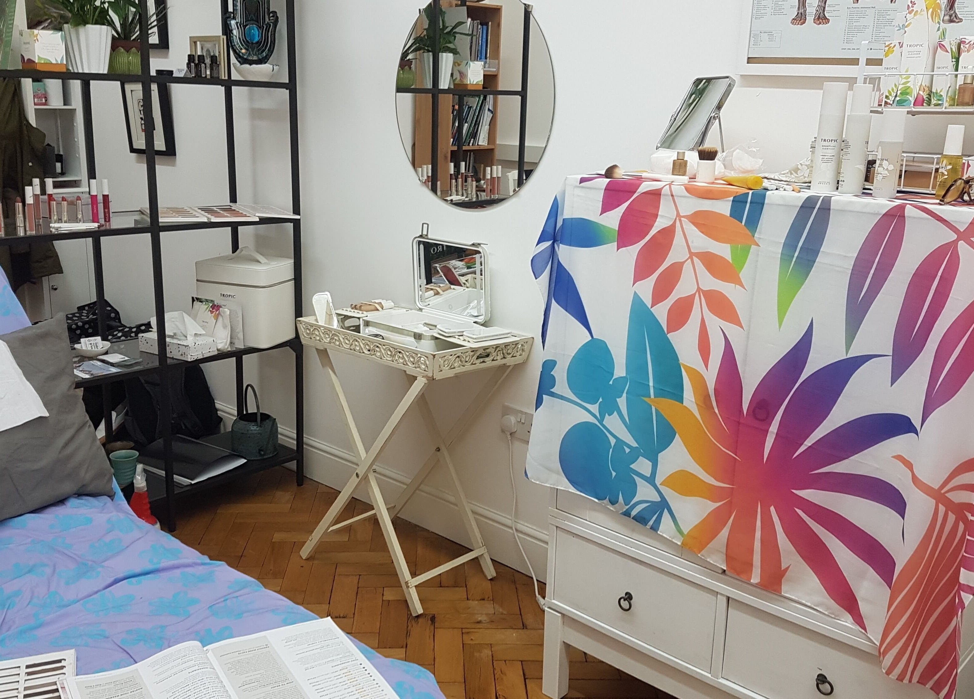 Calm therapy space at Ouseburn Massage Therapy, Newcastle upon Tyne, England, GB with colorful decor and mirrors.